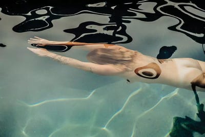 woman swimming naked