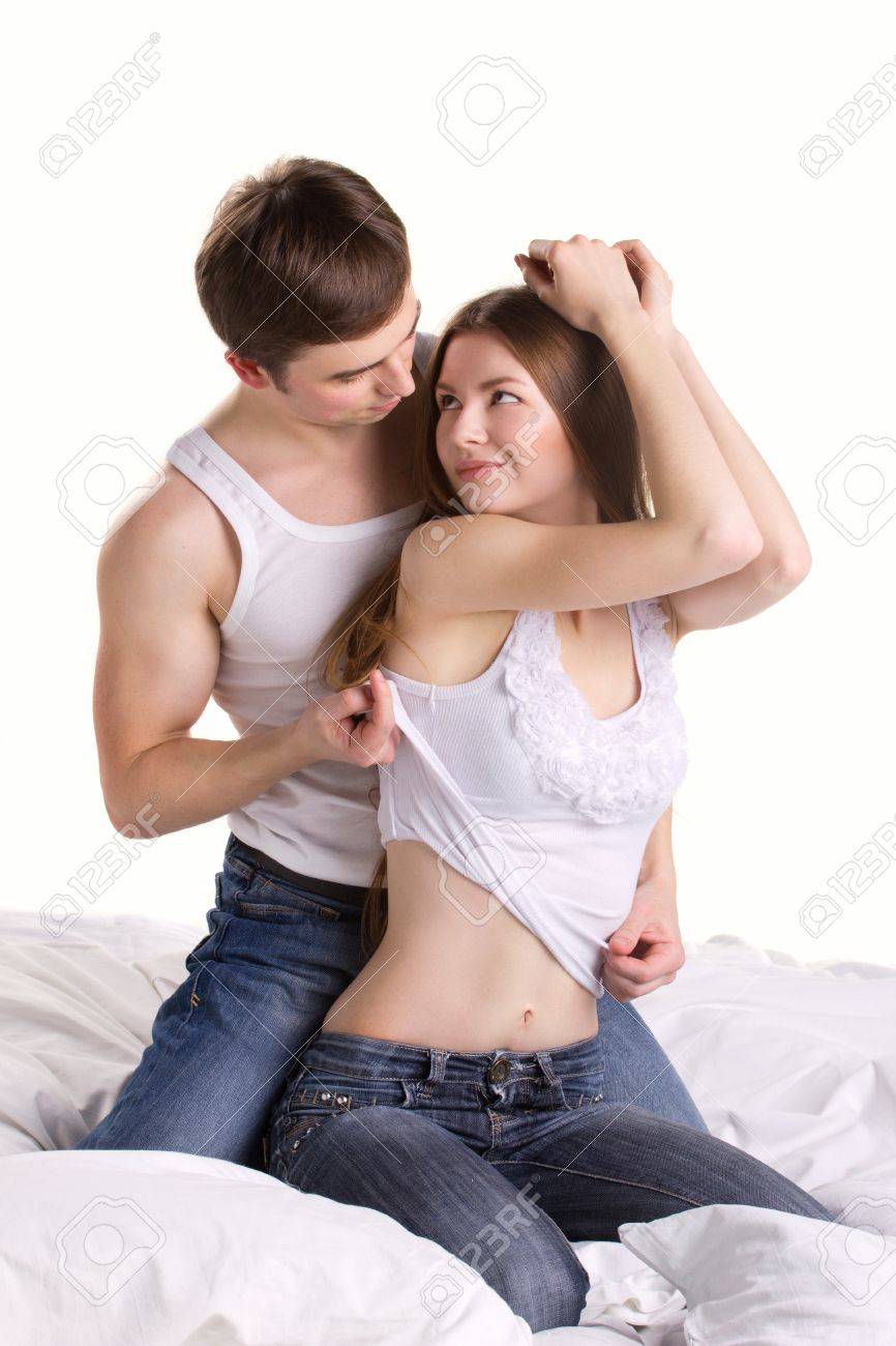 man undressing woman